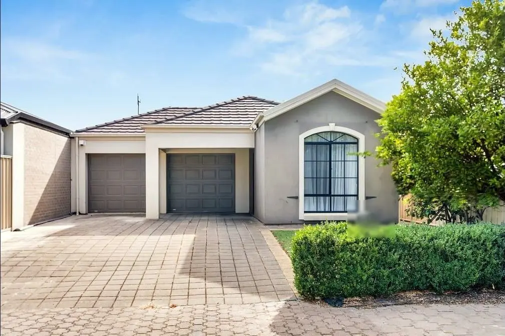 The front of the Condamine Street home in Hillcrest, with a double garage and paved driveway