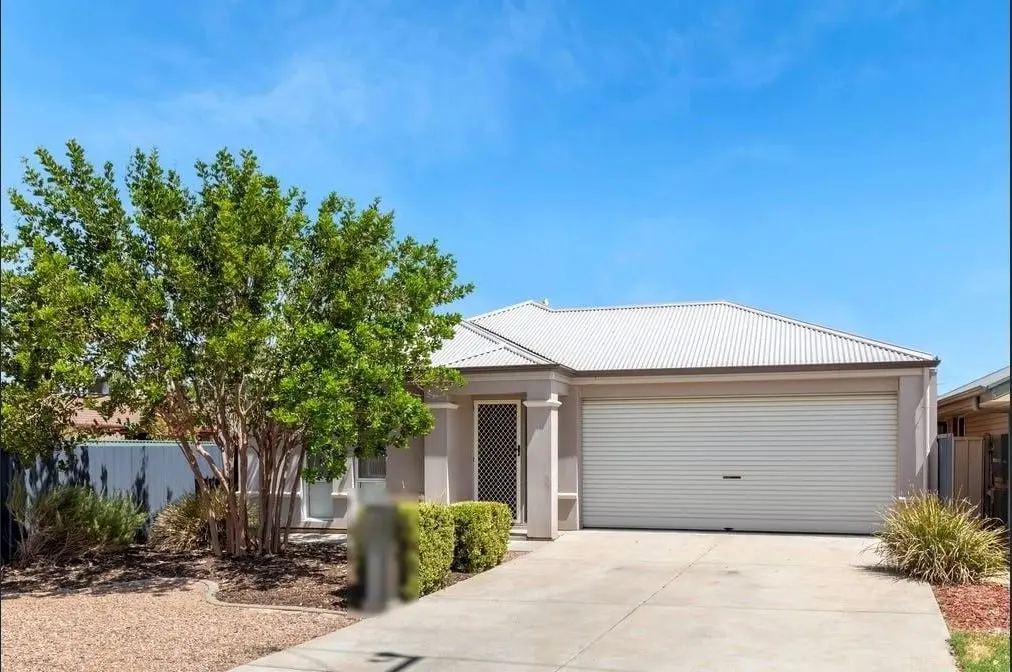The front of the Peerless Road home in Munno Para West, with a double garage