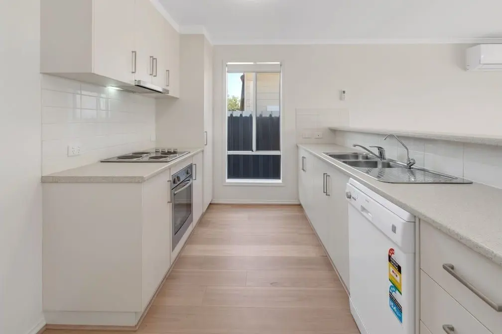 The galley kitchen at the Peerless Road home, with a window at the far end