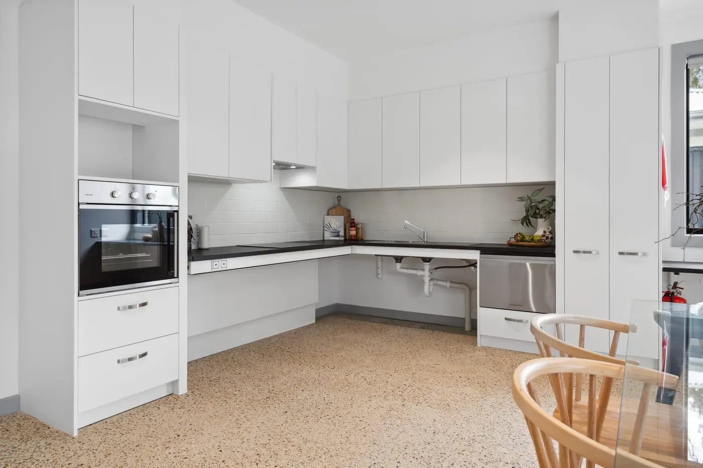 The kitchen bench at the Wyndham Road home, with open space underneath so a wheelchair can pull in